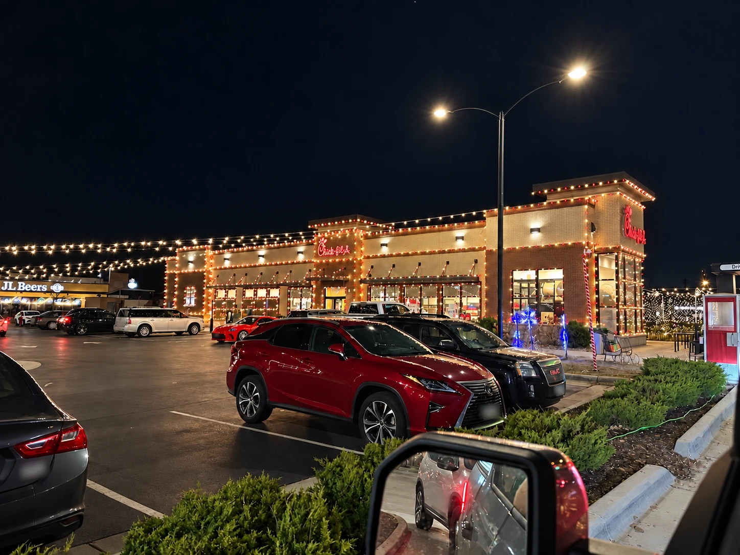 Restaurant roofline Christmas lighting above the parking area
