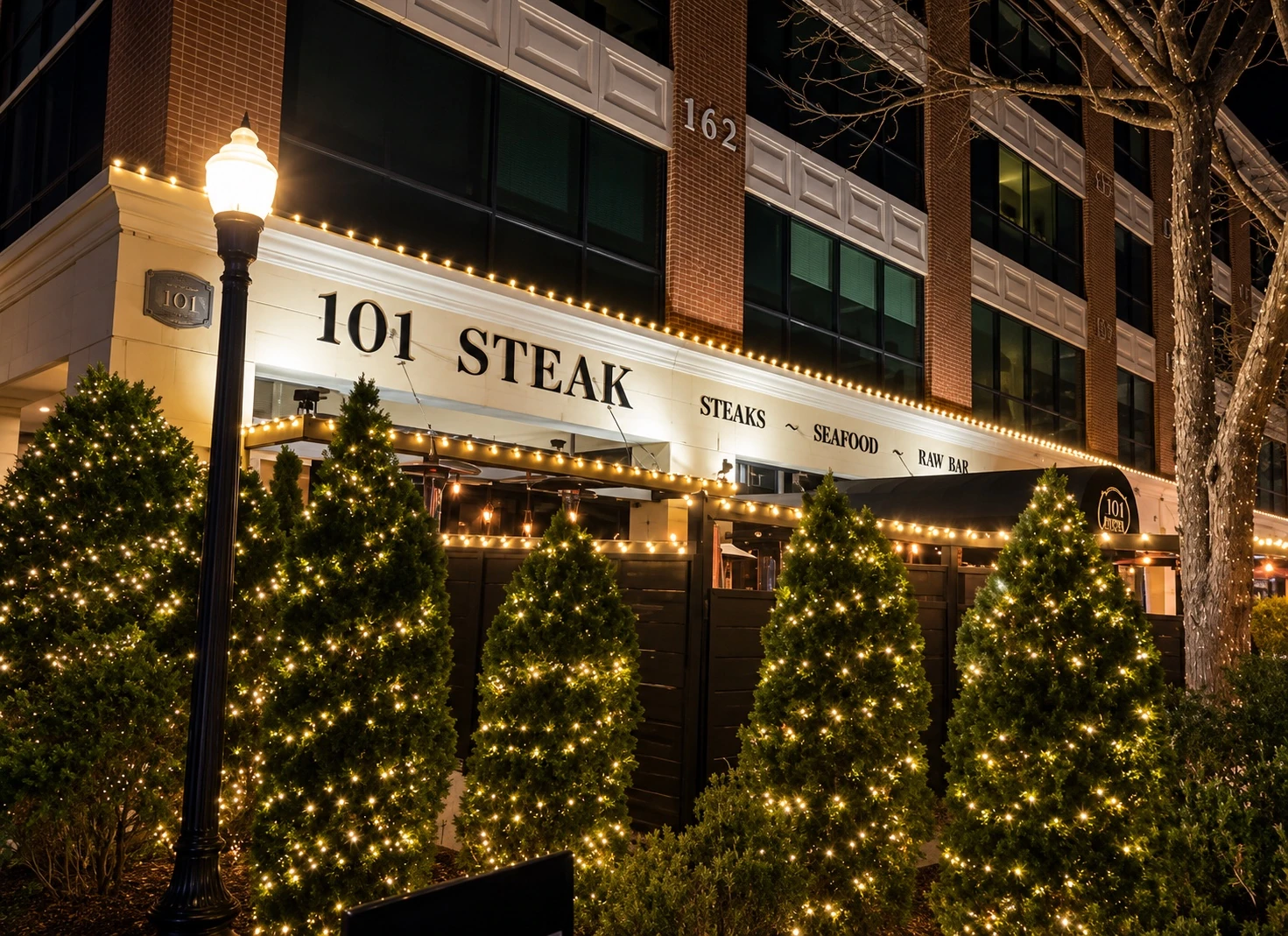 101 Steak commercial property outlined with warm holiday lights