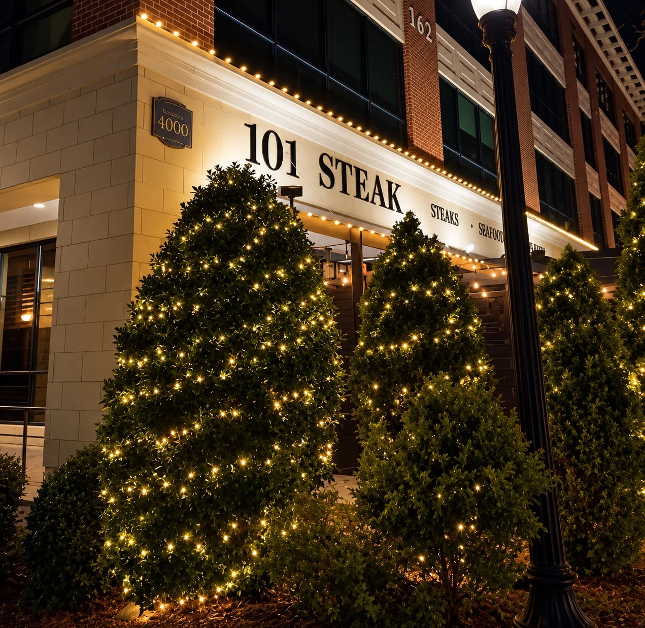 Holiday lighting and greenery at the 101 Steak entrance