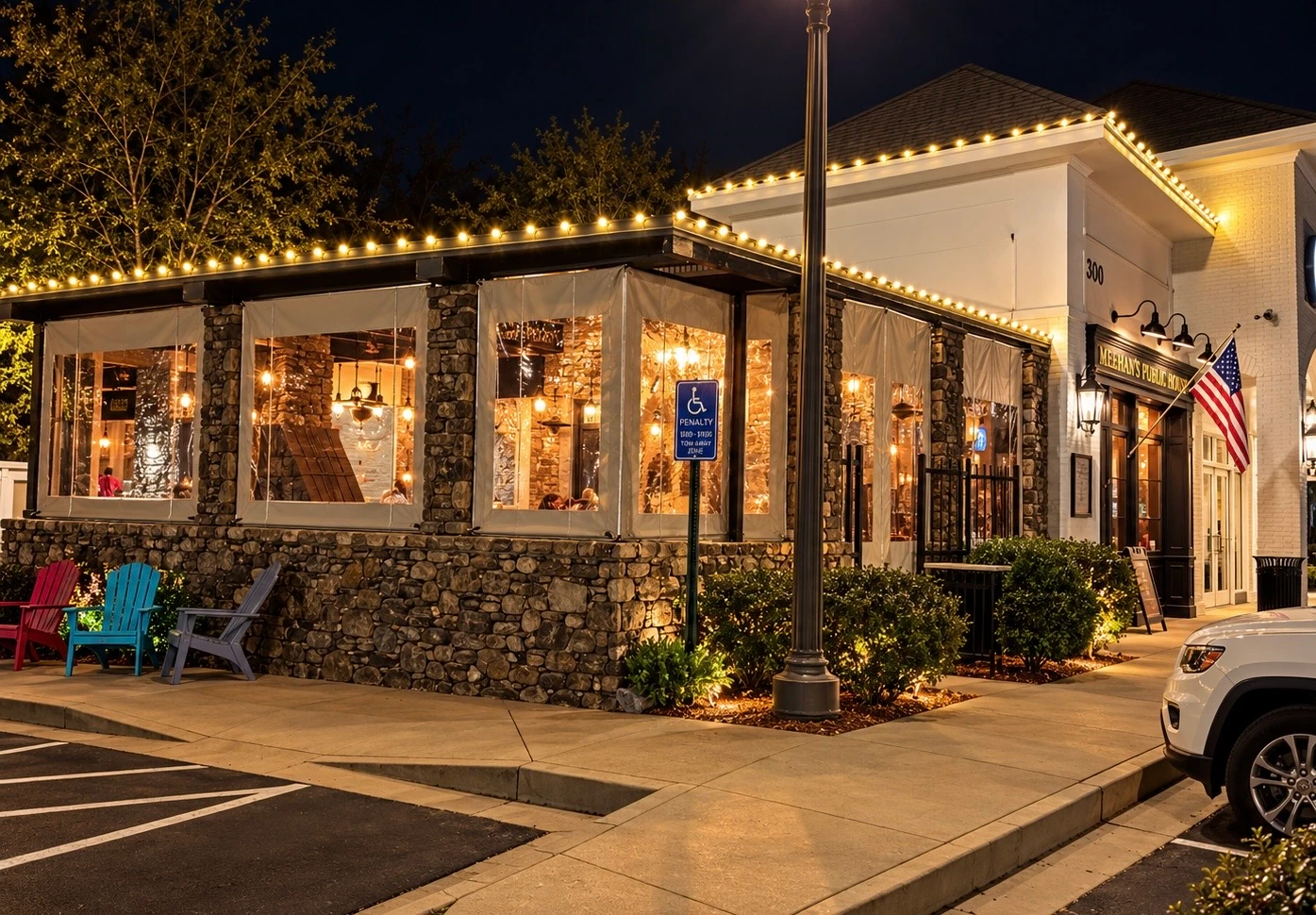 Warm holiday lighting along a restaurant patio