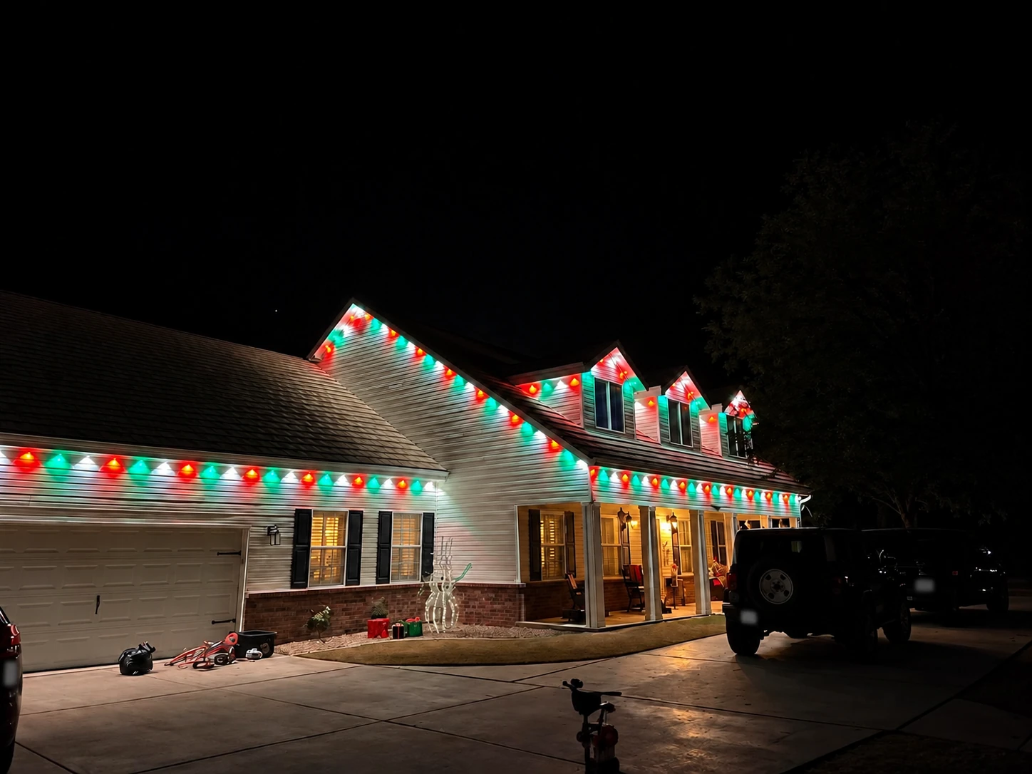 Red, green, and white permanent roofline lighting